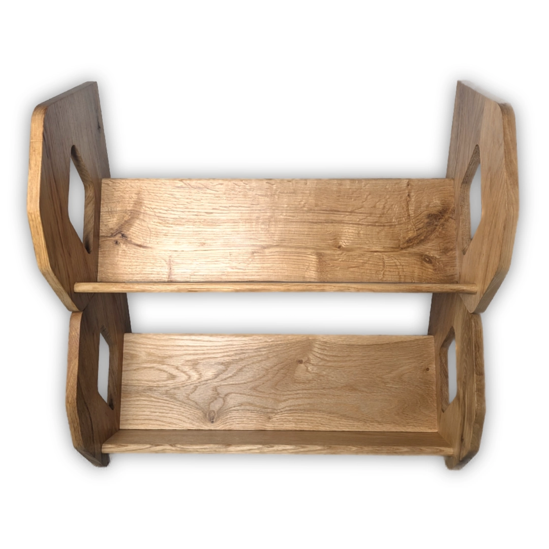 Two troughs for books, stacked on top of one another.