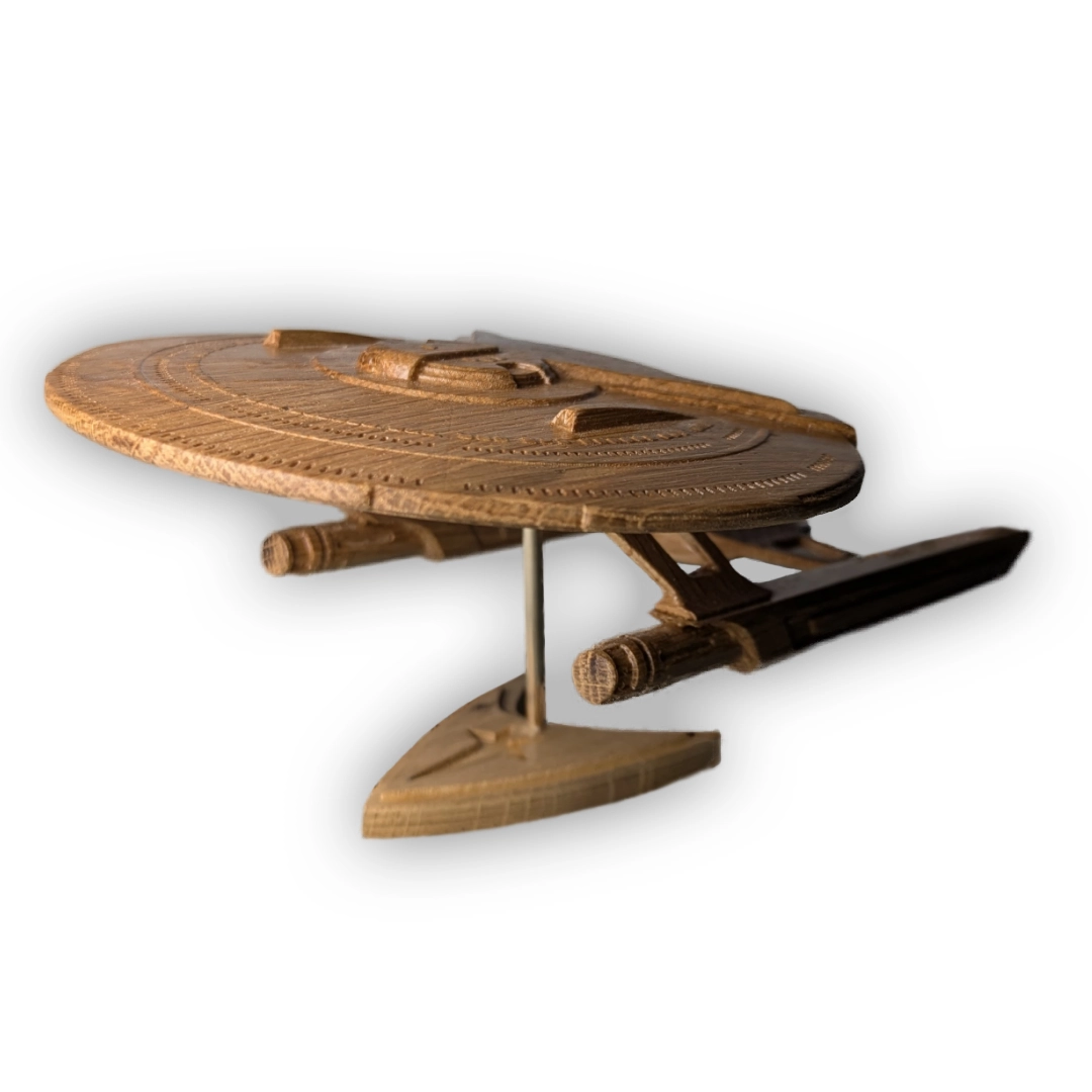 A wooden Star Trek ship with underslung nacelles and many windows on the dish.