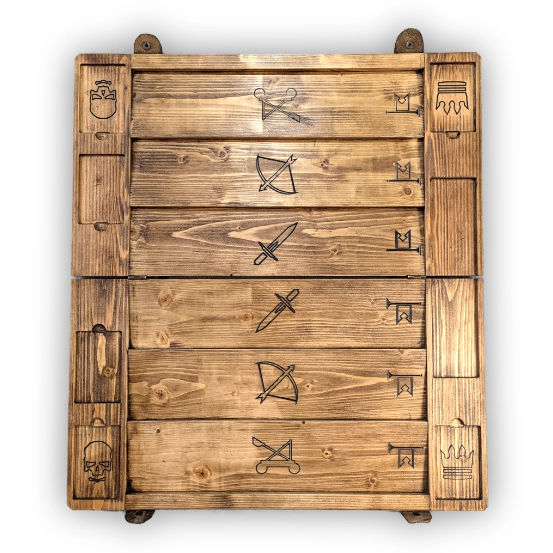 The unfolded Gwent board. Each side has three tracks for cards with different ranges, with engravings of a dagger, a bow and arrow and a catapult.